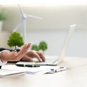 Businessman holding a green tree with esg icon. Concept of esg, environmental